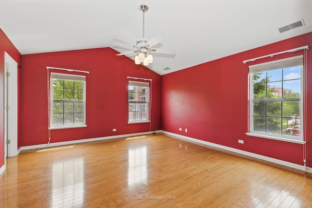221 Willow Blvd, Willow Springs, IL 60480 - empty room with wood finished floors, healthy amount of natural light, ceiling fan, vaulted ceiling, and baseboards