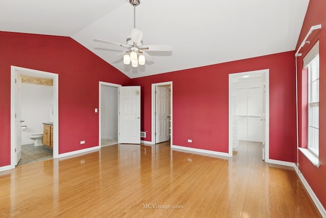 221 Willow Blvd, Willow Springs, IL 60480 - unfurnished bedroom with lofted ceiling, light wood-type flooring, a walk in closet, baseboards, and a closet