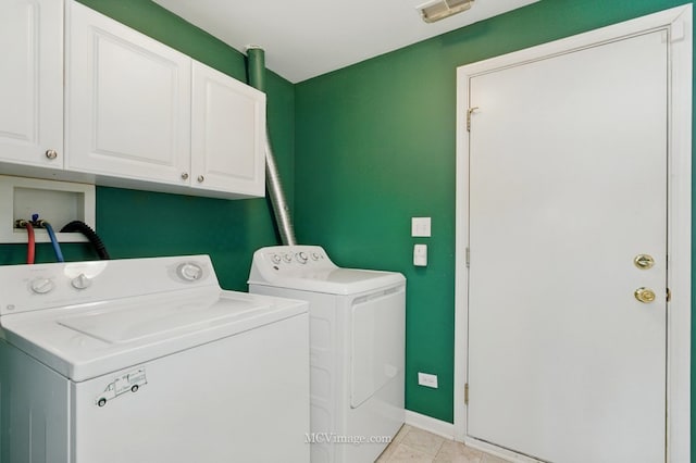 221 Willow Blvd, Willow Springs, IL 60480 - laundry room with cabinet space, separate washer and dryer, light tile patterned floors, and baseboards