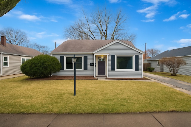 9212 S 49th Ct, Oak Lawn, IL 60453 - view of front facade with a front yard and a shingled roof