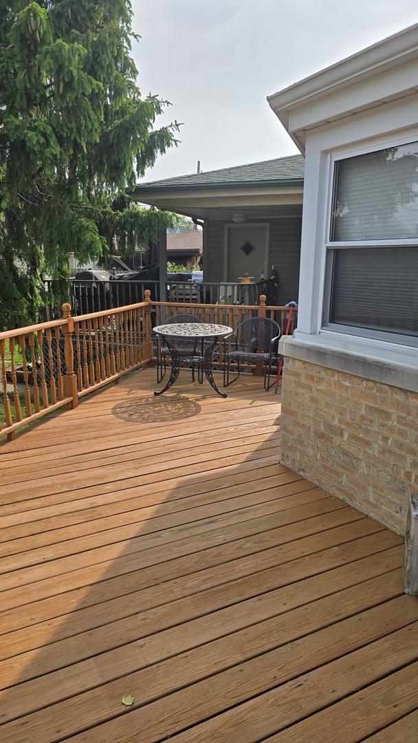 wooden deck featuring outdoor dining space