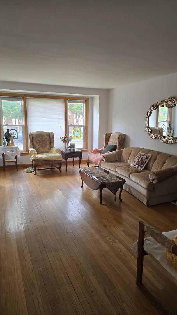 living room featuring plenty of natural light and hardwood / wood-style floors