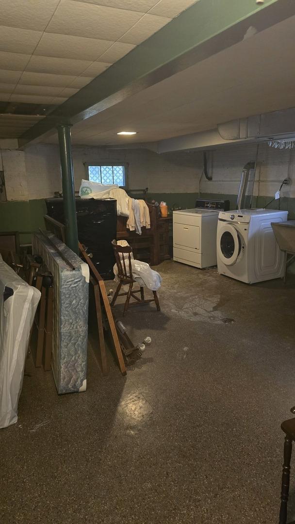 below grade area featuring washing machine and dryer