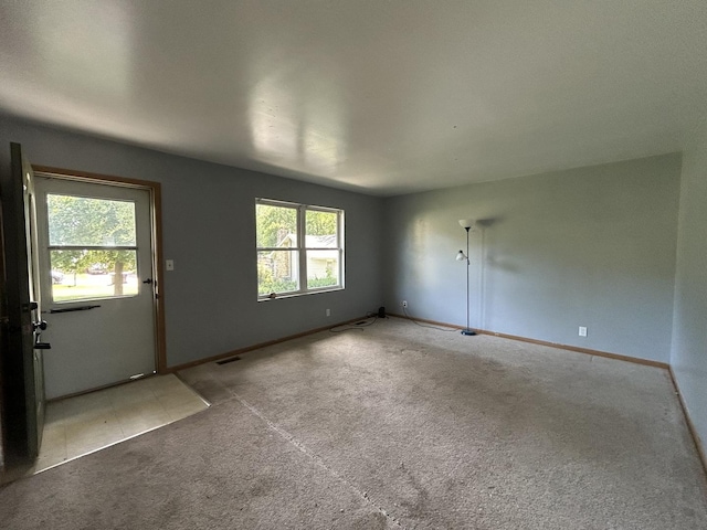 7710 E Sunset Dr, Wonder Lake, IL 60097 - carpeted empty room featuring baseboards