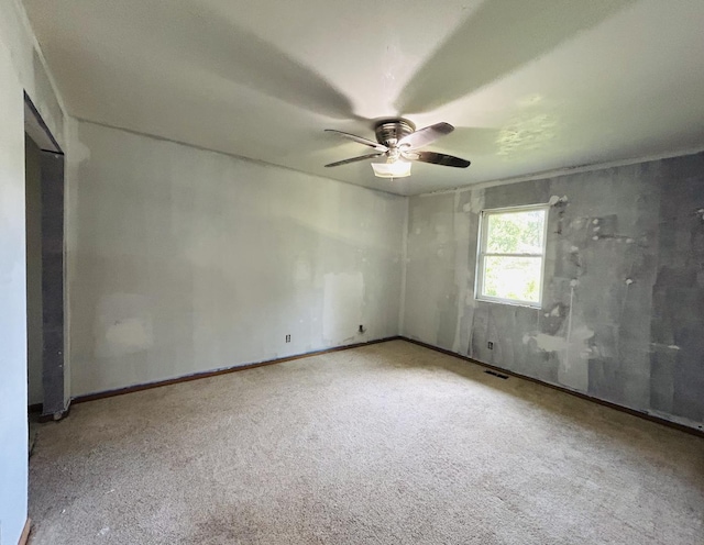 7710 E Sunset Dr, Wonder Lake, IL 60097 - carpeted empty room with a ceiling fan