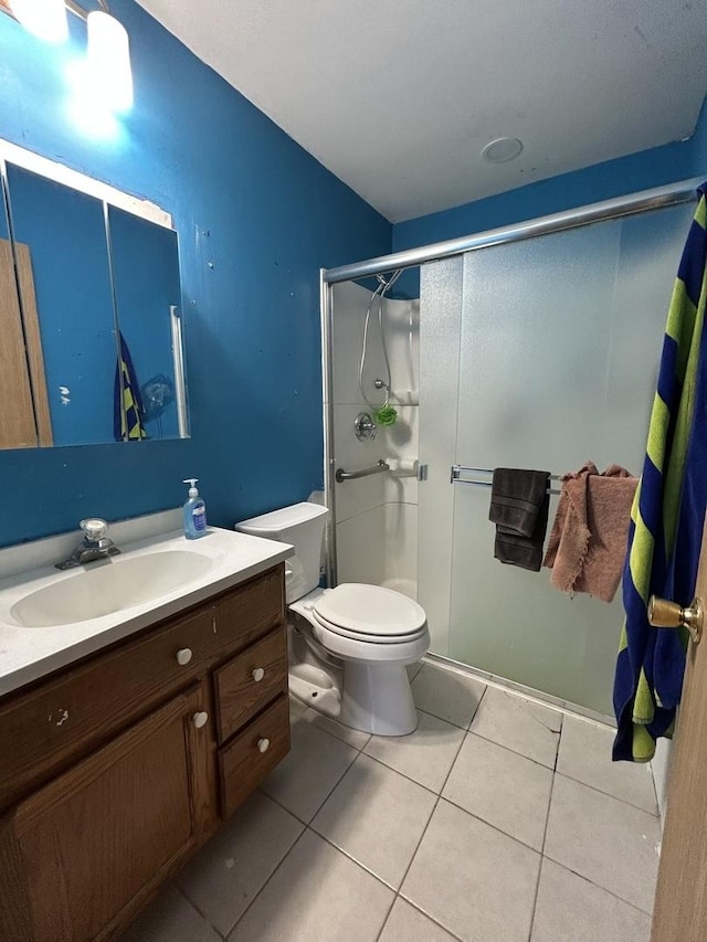 7710 E Sunset Dr, Wonder Lake, IL 60097 - full bathroom with vanity, a stall shower, and tile patterned flooring