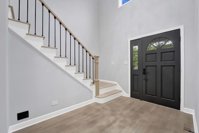 5701 Foxgate Ln, Hinsdale, IL 60521 - entryway featuring wood finished floors, baseboards, stairs, and a high ceiling