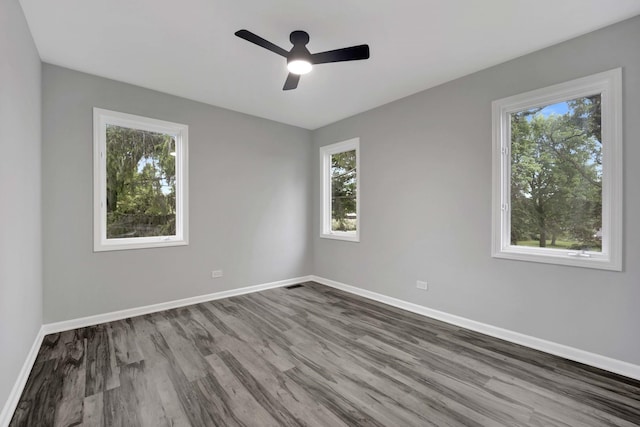 5701 Foxgate Ln, Hinsdale, IL 60521 - spare room featuring plenty of natural light, dark wood finished floors, and baseboards