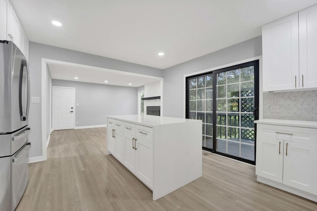 5701 Foxgate Ln, Hinsdale, IL 60521 - kitchen featuring freestanding refrigerator, light wood finished floors, white cabinets, light countertops, and recessed lighting