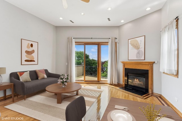 2538 W Flournoy St Unit 3, Chicago, IL 60612 - living area featuring wood finished floors, a glass covered fireplace, recessed lighting, and a ceiling fan