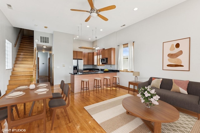 2538 W Flournoy St Unit 3, Chicago, IL 60612 - living room featuring stairs, light wood-style flooring, ceiling fan, and recessed lighting