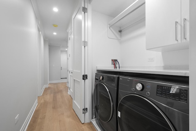 1834 N Hudson Ave Unit 2, Chicago, IL 60614 - washroom featuring separate washer and dryer, light wood finished floors, recessed lighting, and baseboards