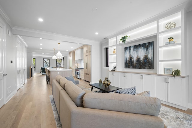 1834 N Hudson Ave Unit 2, Chicago, IL 60614 - living room with crown molding, light wood finished floors, recessed lighting, baseboards, and built in features