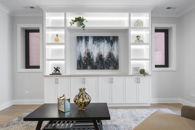 1834 N Hudson Ave Unit 2, Chicago, IL 60614 - living area with light wood-style floors, baseboards, ornamental molding, and built in shelves