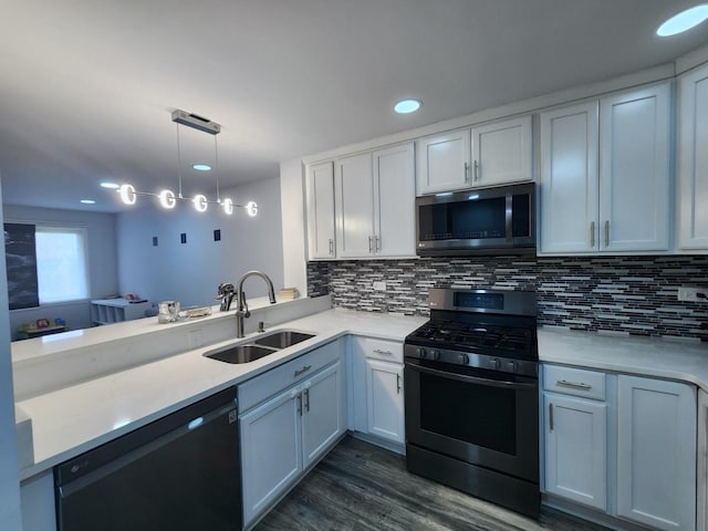 320 Sheridan Dr Unit 2C, Willowbrook, IL 60527 - kitchen with stainless steel microwave, range with gas cooktop, dishwashing machine, a sink, and light countertops