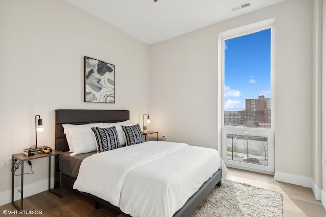 2342 W Adams St Unit 406, Chicago, IL 60612 - bedroom with wood finished floors and baseboards