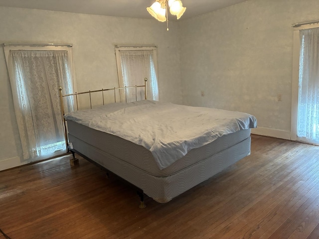 115 N Clay St, Mount Carroll, IL 61053 - bedroom with dark wood-style floors
