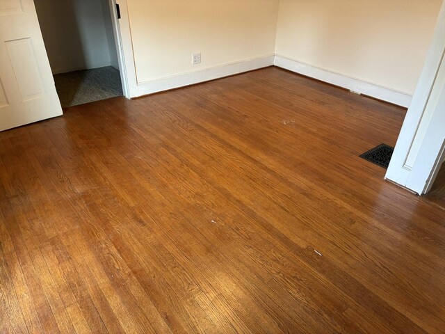 115 N Clay St, Mount Carroll, IL 61053 - unfurnished room with wood finished floors and baseboards