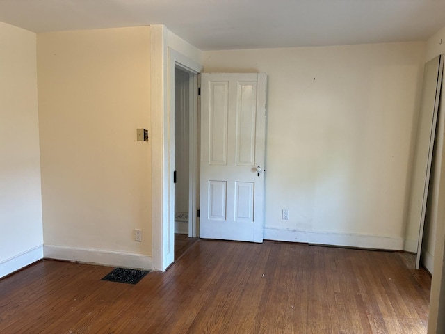115 N Clay St, Mount Carroll, IL 61053 - empty room with wood finished floors and baseboards