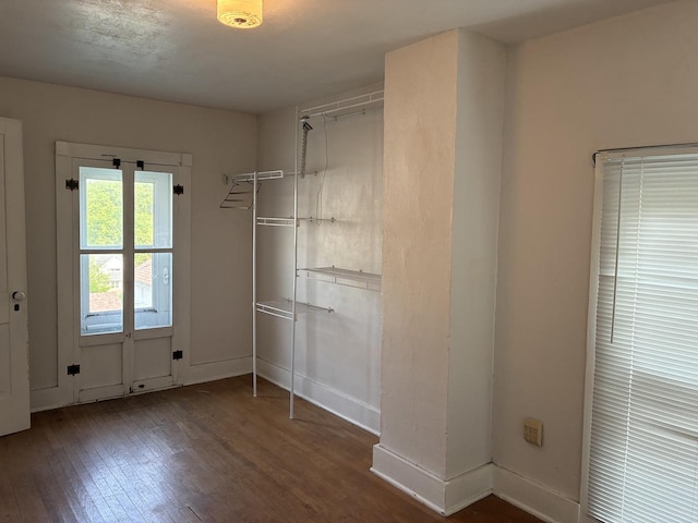 115 N Clay St, Mount Carroll, IL 61053 - unfurnished bedroom with wood finished floors and baseboards