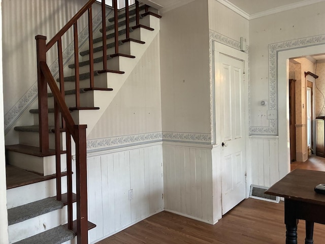 115 N Clay St, Mount Carroll, IL 61053 - staircase with wainscoting, wood finished floors, and crown molding