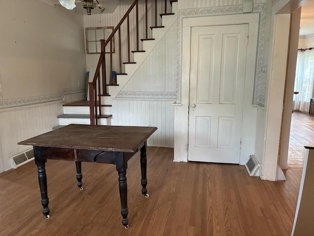 115 N Clay St, Mount Carroll, IL 61053 - stairs featuring wood finished floors and a wainscoted wall