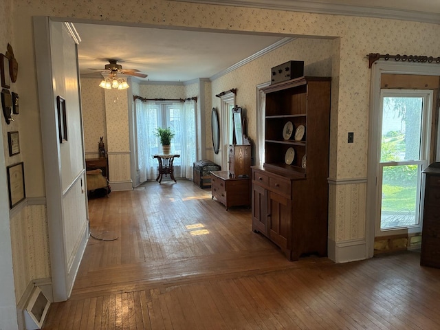 115 N Clay St, Mount Carroll, IL 61053 - hall featuring wallpapered walls, crown molding, and light wood-style flooring