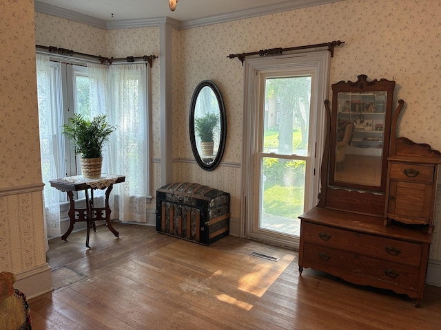 115 N Clay St, Mount Carroll, IL 61053 - entryway with wallpapered walls, ornamental molding, hardwood / wood-style flooring, and healthy amount of natural light