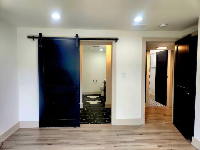 3601 W 123rd Pl, Alsip, IL 60803 - spare room featuring a barn door, baseboards, light wood finished floors, a smoke detector, and recessed lighting