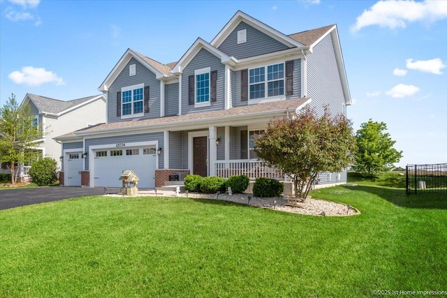 25734 Galway Ave, Plainfield, IL 60585 - view of front of house with a porch, a garage, a front yard, and driveway