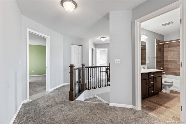 25734 Galway Ave, Plainfield, IL 60585 - hallway with an upstairs landing, baseboards, and carpet flooring