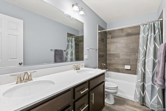 25734 Galway Ave, Plainfield, IL 60585 - bathroom with double vanity, toilet, shower / bath combo with shower curtain, and wood finished floors