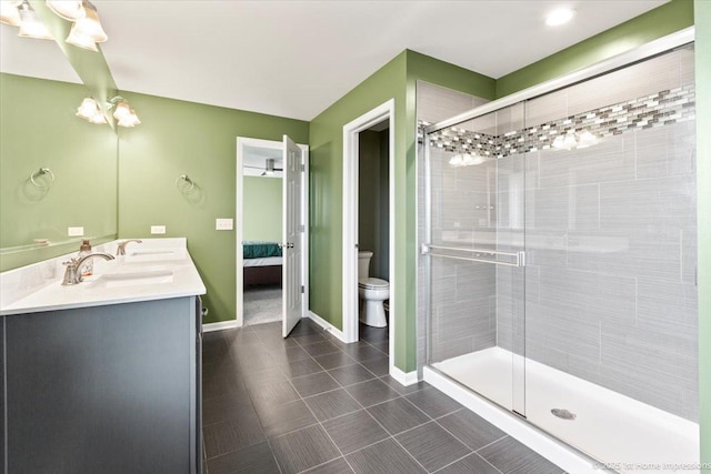 25734 Galway Ave, Plainfield, IL 60585 - bathroom with toilet, double vanity, a stall shower, connected bathroom, and baseboards