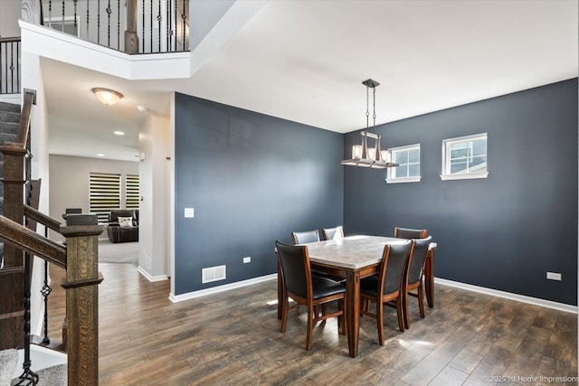 25734 Galway Ave, Plainfield, IL 60585 - dining room featuring stairway, dark wood-style flooring, a chandelier, baseboards, and recessed lighting