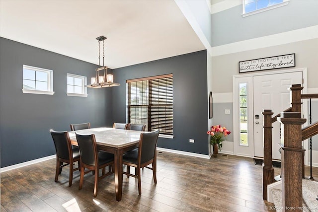 25734 Galway Ave, Plainfield, IL 60585 - dining space with stairs, dark wood-style floors, a chandelier, and baseboards