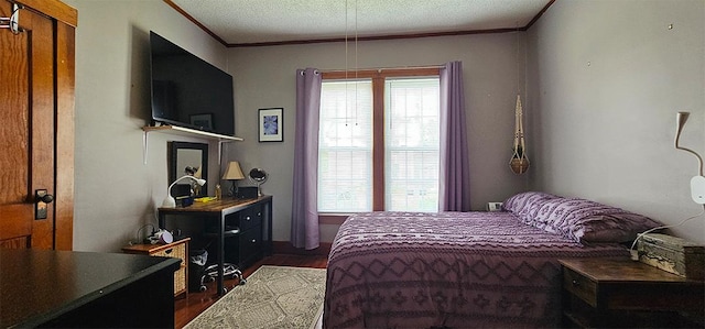 515 E Main St E, Amboy, IL 61310 - bedroom featuring dark wood-type flooring, crown molding, and a textured ceiling