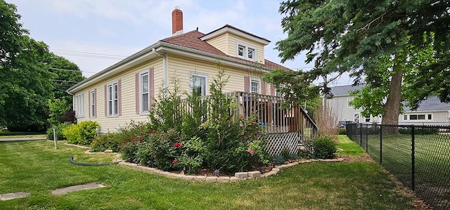 515 E Main St E, Amboy, IL 61310 - view of side of property with a chimney and a deck