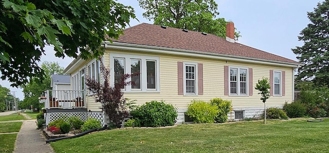 515 E Main St E, Amboy, IL 61310 - view of property exterior with a chimney and a yard