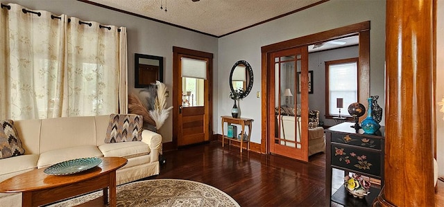 515 E Main St E, Amboy, IL 61310 - living area with wood finished floors, a textured ceiling, crown molding, and baseboards