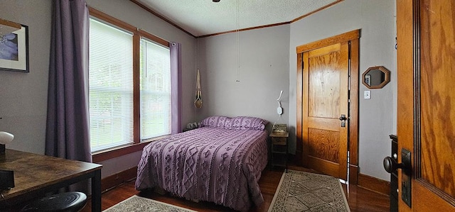 515 E Main St E, Amboy, IL 61310 - bedroom with wood finished floors, ornamental molding, a textured ceiling, and baseboards