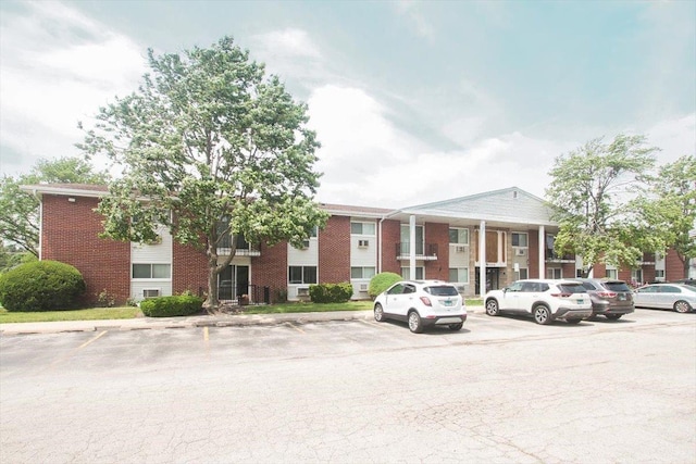 9204 Bumble Bee Dr Unit 1H, Des Plaines, IL 60016 - view of building exterior with uncovered parking
