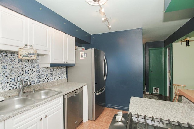 9204 Bumble Bee Dr Unit 1H, Des Plaines, IL 60016 - kitchen featuring appliances with stainless steel finishes, a sink, white cabinetry, and light countertops