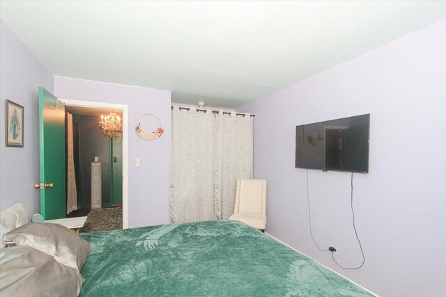 9204 Bumble Bee Dr Unit 1H, Des Plaines, IL 60016 - carpeted bedroom featuring a chandelier