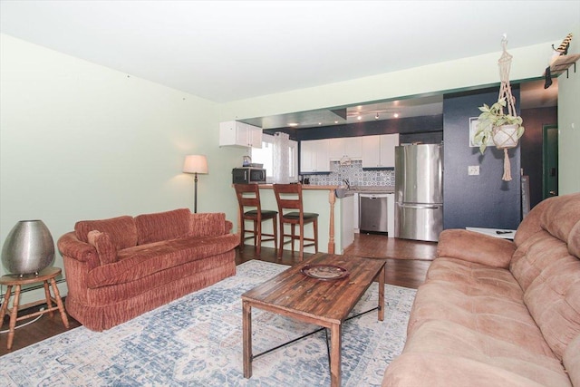 9204 Bumble Bee Dr Unit 1H, Des Plaines, IL 60016 - living room featuring dark wood-style floors and baseboard heating