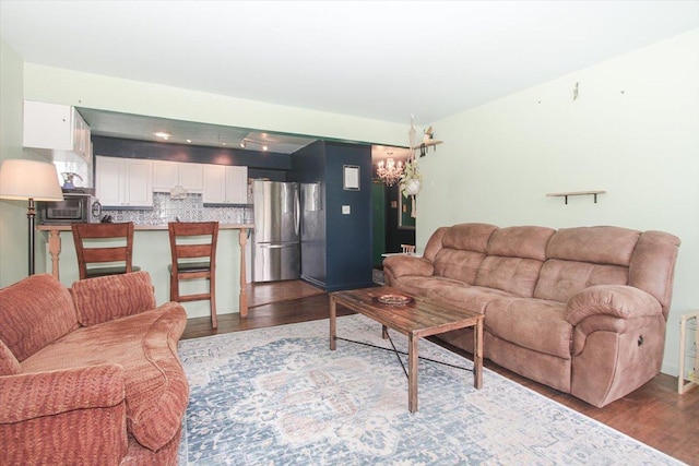 9204 Bumble Bee Dr Unit 1H, Des Plaines, IL 60016 - living area with dark wood-style flooring and a chandelier