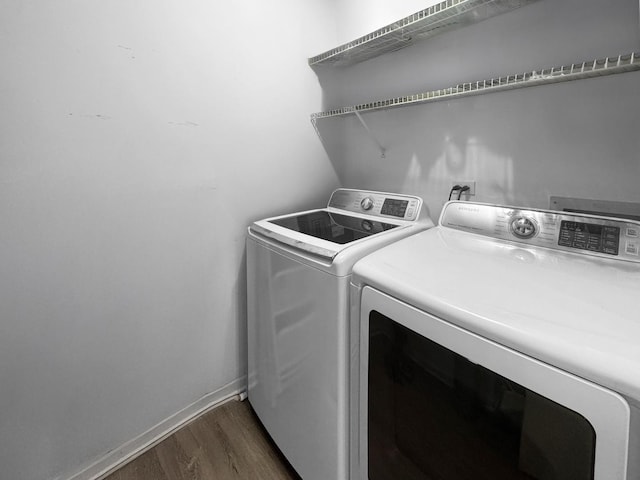 1388 Stratford Dr Unit 12-C-2, Gurnee, IL 60031 - laundry area featuring separate washer and dryer, dark wood-type flooring, and baseboards