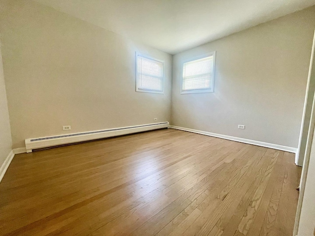 406 Franklin Ave Unit 2A, River Forest, IL 60305 - empty room with a baseboard radiator, wood finished floors, and baseboards