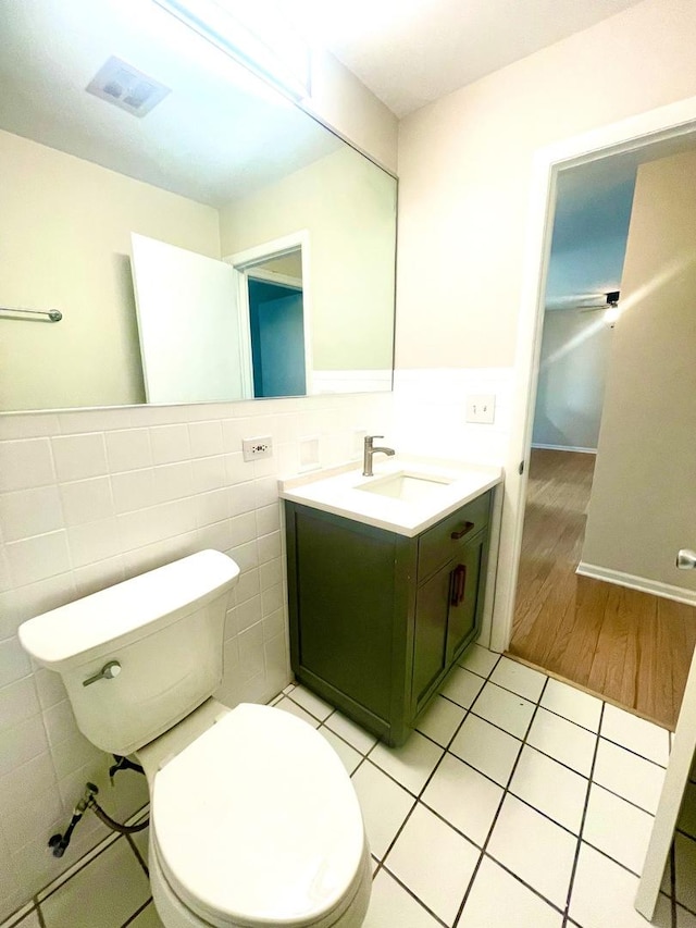 406 Franklin Ave Unit 2A, River Forest, IL 60305 - half bath with vanity, toilet, tile patterned flooring, tile walls, and wainscoting