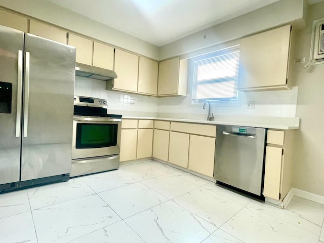 406 Franklin Ave Unit 2A, River Forest, IL 60305 - kitchen featuring appliances with stainless steel finishes, cream cabinets, light marble finish flooring, and under cabinet range hood