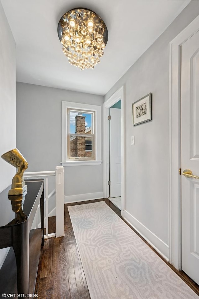 5146 N Mobile Ave, Chicago, IL 60630 - entryway with wood finished floors, a chandelier, and baseboards